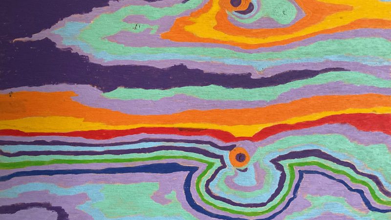 An abstract painting with swirls of purple, light blue, orange, red and yellow paint.