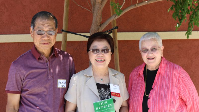 A group picture with the author of the book, Our Stories.