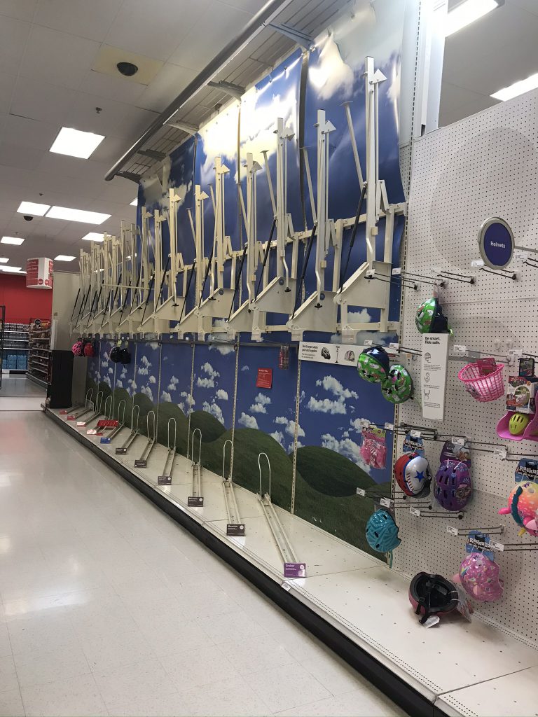 Empty bike rack isle inside Target.