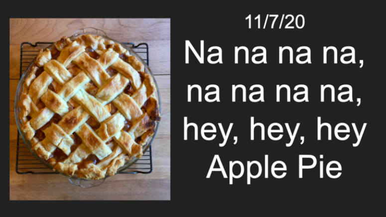 A photo of an apple pie with the text "Na na na na, na na na na, hey, hey, hey Apple Pie."