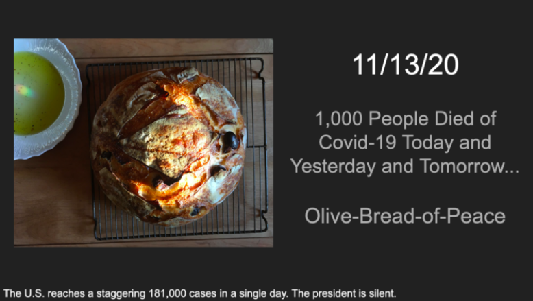 A photograph of a loaf of bread with the text "1,000 People Died of Covid-19 Today and Yesterday and Tomorrow.... Olive-Bread-of-Peace."