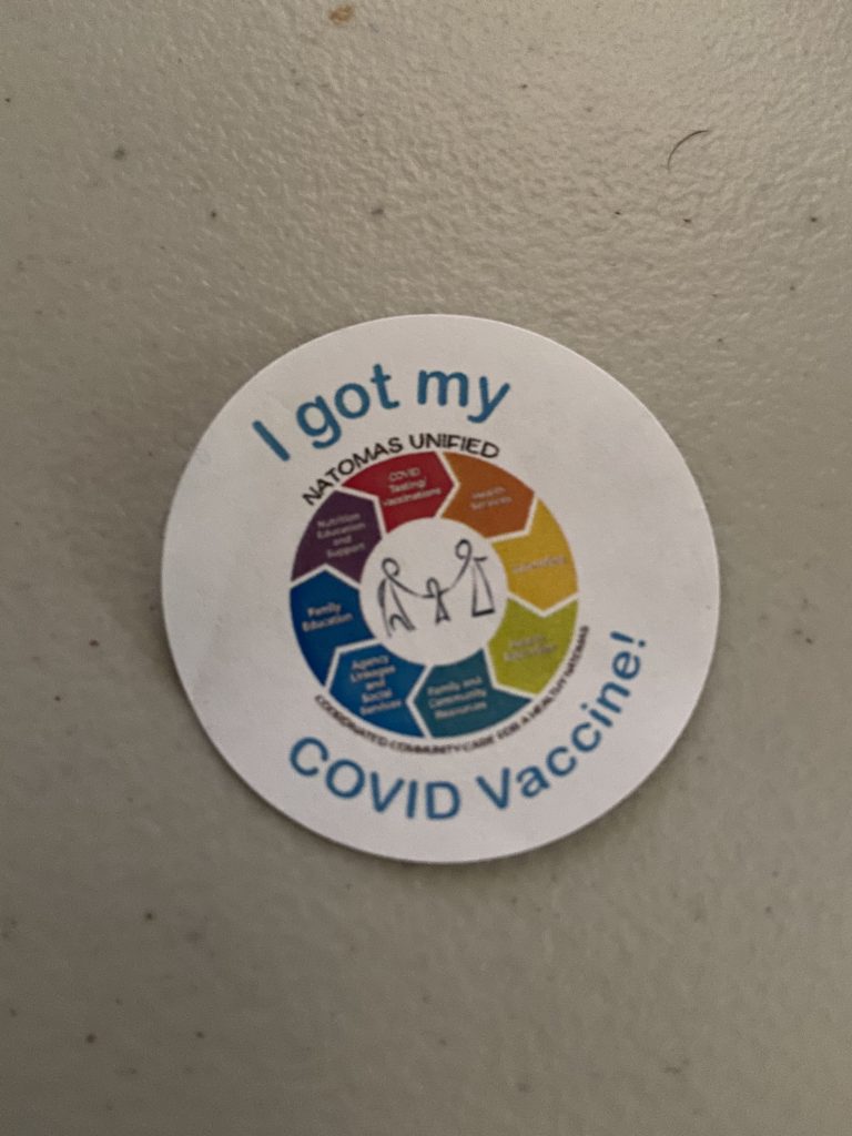 A round sticker that says "I got my COVID vaccine!"